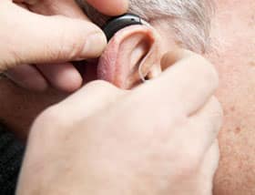 Man getting a hearing aid fitting
